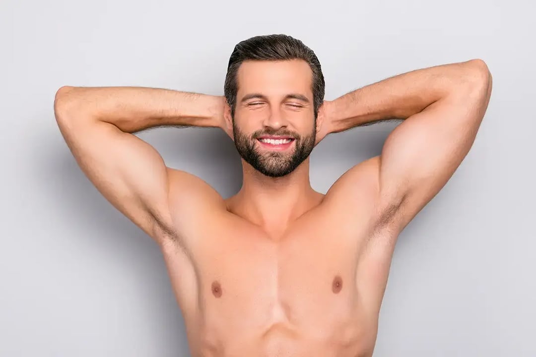 attractive stunning manly smiling macho isolated on gray background